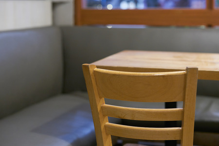 resting corner surround leather sofa and wooden table and chair