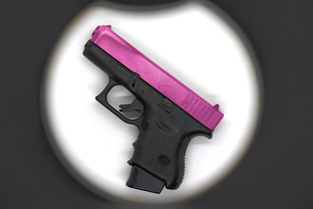 Shot gun black color grip part and pink chrome slide barrel,use 9 mm ammunition with magazine grip accessoryの写真素材