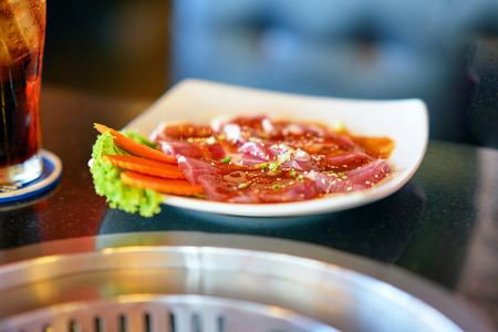 Slice flesh meat in plate for grill japanese styleの写真素材
