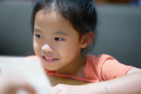 Girl smile on somethingの写真素材