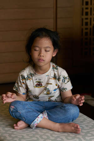 Girl or kid meditation in actionの写真素材