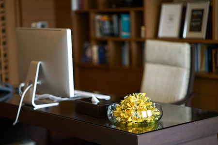 Flower vase of work table on blur Room office of Manager or headmaster include computer armchairの写真素材