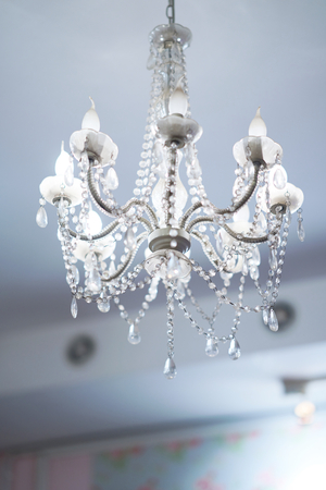 lamp hangs on ceiling by chandelier styleの写真素材