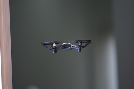 Drone flys over door inside house