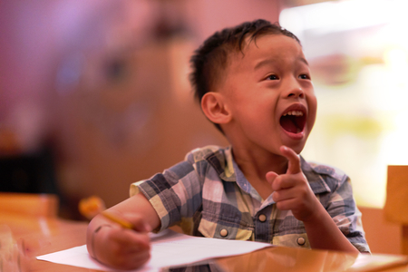 Boy is laughing and fun in class educationの写真素材