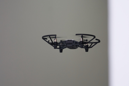 Back aspect of UAV or drone fly in roomの写真素材