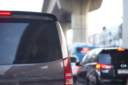 Rear view of Van for transport passengers on blur city background