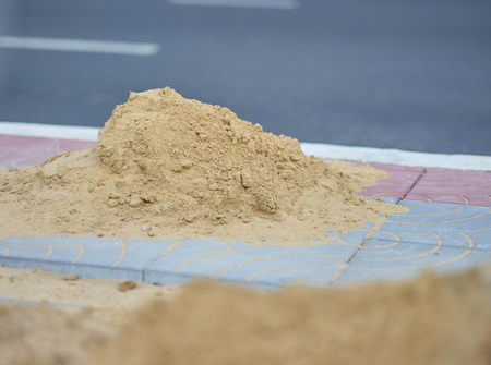 pile of sand on footpath