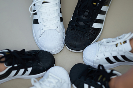 Bangkok,Thailand,July 18,2018-Pairs of black and white color sneaker adidas shoes in three  sizes.jpgのeditorial素材