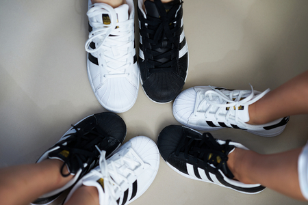 Bangkok,Thailand,July 18,2018-Pairs of black and white color sneaker adidas shoes in three sizes.jpgのeditorial素材