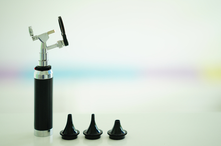 Otoscope for ear check for doctor ENT  with 3 sizes of specula pieces on blur background with copy spaceの写真素材