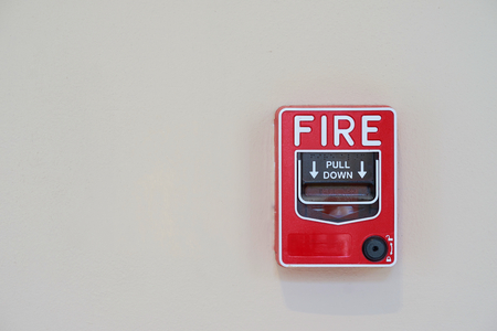 Fire or smoke alarm switch on wallの写真素材