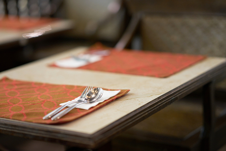 Spoon and fork on table preparation for food meal in restaurantの写真素材