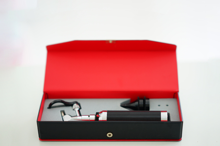 Otoscope for ear check for doctor ENT in block box on blur backgroundの写真素材
