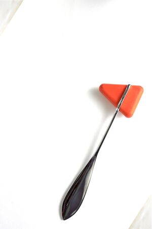 Hammer jerk for doctor uses neuro exam on white background,portrait orientationの写真素材