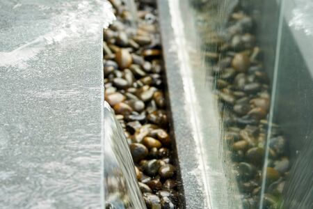 water overflow from beside pool with mirrorの写真素材