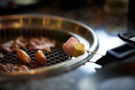 Grilling Marshmallows on asian grill styleの写真素材