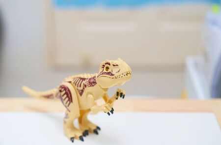 T rex or Tyranosaurus dinosaur toy in hunting postureの写真素材