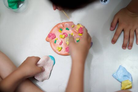 Kid make pizza colorful slime with container for kid activity conceptの写真素材