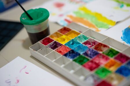 multiple color palette with brush for art work of kid or artist on workspaceの写真素材