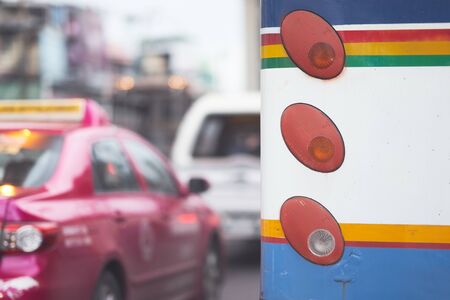 Vintage style of rear lamp signal of old bus on traffic backgruondの写真素材