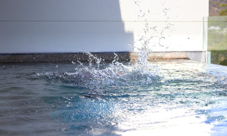 water splash in swimming with sun light,selective focusの写真素材