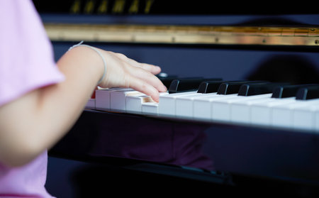 hand plays piano key with copy spaceの写真素材