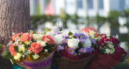 congratulation flowers on blur outdoors background