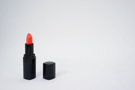 red pastel lipstick on isolated white background with copy spaceの写真素材