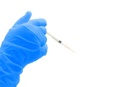 blue medical doctor glove hold syringe of drug isolated on white with copy spaceの写真素材