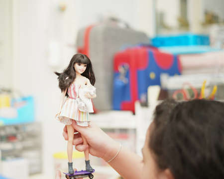 Bangkok,Thailand,Aug 5,2021-girl play Barbie doll on tableのeditorial素材