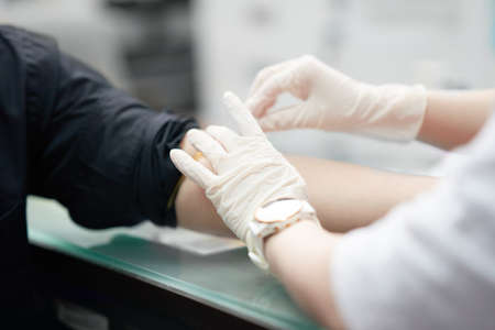 doctor draw blood fron vein of patient for test diagnosisの写真素材