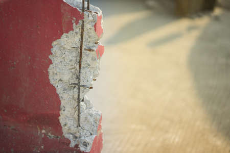 crack broke ruin cement show metal structure inside for safety engineer construction accident crash concept on traffic transportation barriersの写真素材