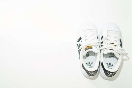 bangkok,Thailand,July 2,2021-original adidas  sneakers shoes with shoelace on floor top view soft focus with copy spaceのeditorial素材