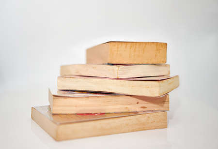 stacks of books on white background front viewの写真素材