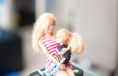 Bangkok,Thailand,Aug 10,2021- Barbie dolls mom and little daughter hold in hug sit on tableのeditorial素材