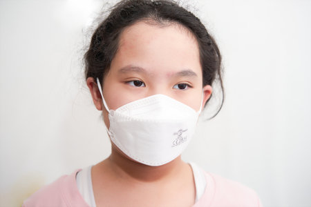Bangkok,Thailand,June 27,2021-asia young girl wear protect mask for covid-19 look away from cameraのeditorial素材