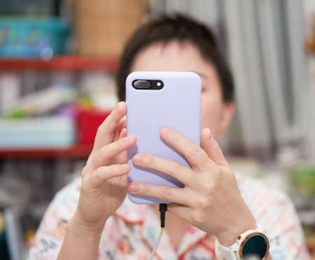 woman using phone camera to takee picture and images