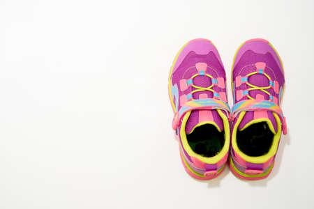 bangkok,Thailand,July 2,2021-color kid  sneakers shoes on floor top view soft focus with copy spaceのeditorial素材