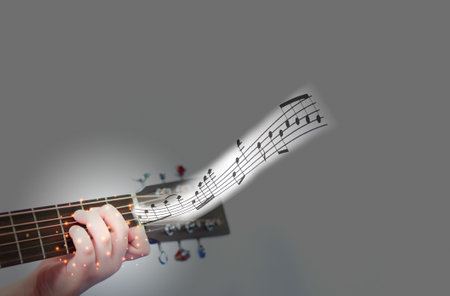 the hands that are holding the chords, play a song guitarの写真素材