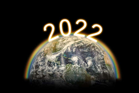 2022 new year globe planet world numberic shine with sunrise and rainbowの写真素材