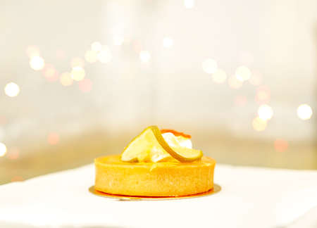 mini piece round yellow lemon tart on tableの写真素材