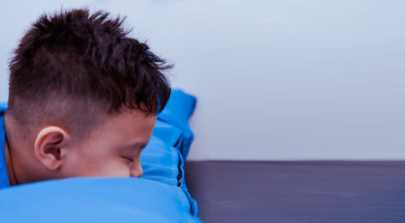 boy kid lying down interior with boredの写真素材