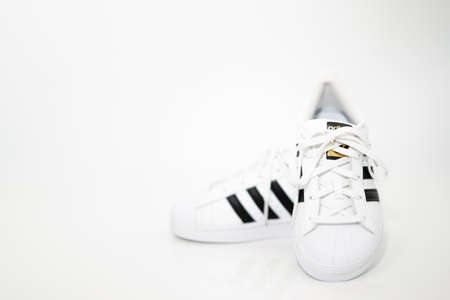 bangkok,Thailand,July 2,2021-original adidas  sneakers shoes with shoelace on white floor front view soft focus with copy spaceのeditorial素材