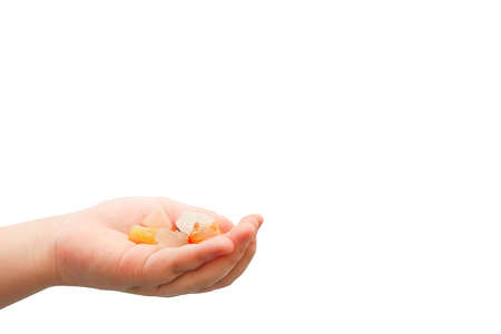 Hand holding a jewel in hand, on a white backgroundの写真素材