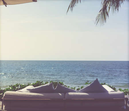sofa chair beside beach for seeing view of the sea in hotel resort. intake film grain toneの写真素材