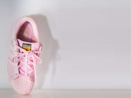 bangkok,Thailand,July 2,2021-adidas pink sneakers shoes with shoelace on wall soft focusのeditorial素材