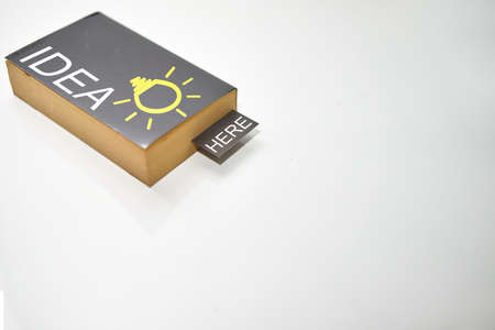 Bookmark in old book on white high angle view with copy spaceの写真素材