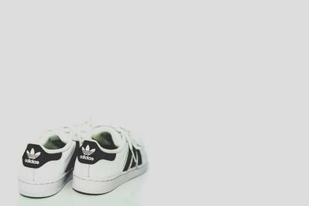 bangkok,Thailand,July 2,2021-original adidas  sneakers shoes with shoelace on white floor rear view soft focus with copy spaceのeditorial素材