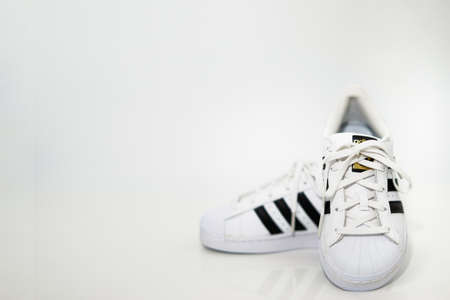 bangkok,Thailand,July 2,2021-original adidas  sneakers shoes with shoelace on white floor front view soft focus with copy spaceのeditorial素材